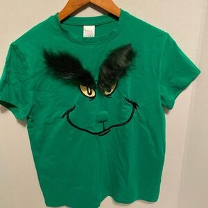 Playful Green Grinch Face T-Shirt with Furry Eyebrows